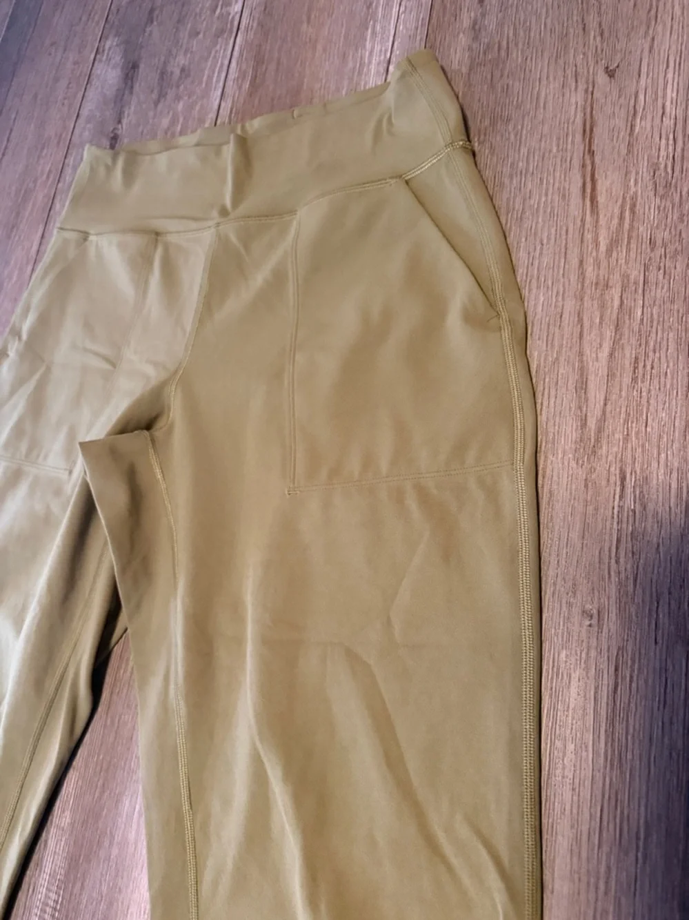 Lululemon Align High-Rise Cropped Jogger Capris in a bronze green color.